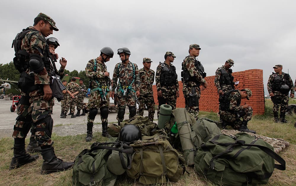 Nepalese army soldiers prepare to leave for a rescue mission to the site where the suspected wreckage of a US Marine helicopter, that disappeared earlier this week while on a relief mission in the earthquake-hit Himalayan nation, was spotted, in Kathmandu, Nepal.