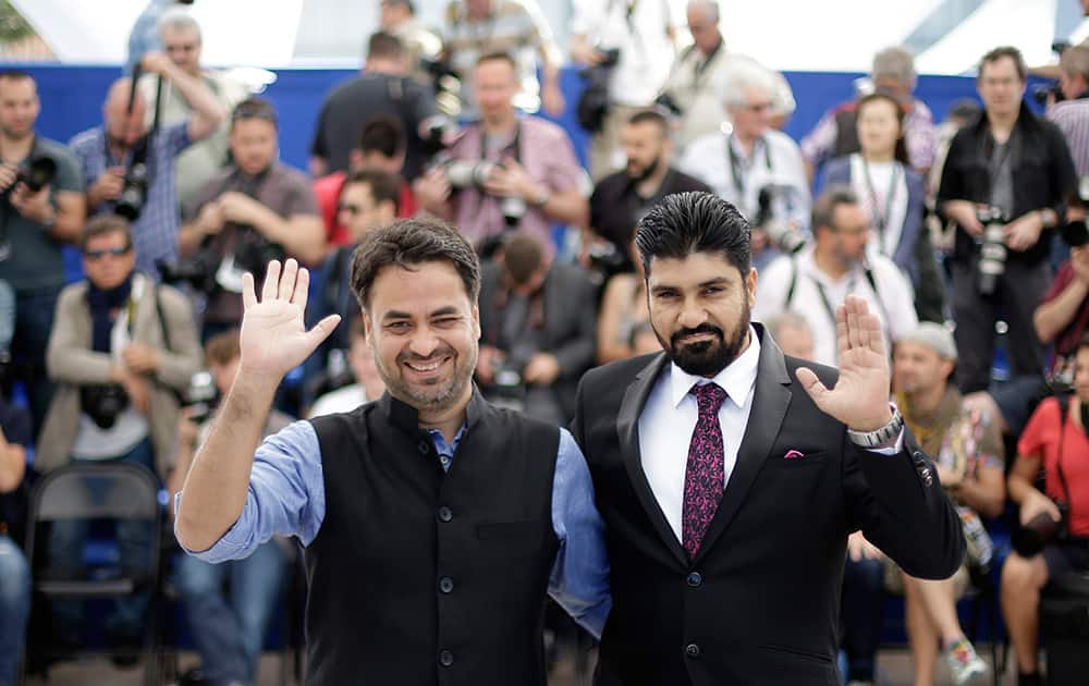 Director Gurvinder Singh, left, and actor Vikky Suvinder pose for photographers during a photo call for the film Chauthi Koot (The Fourth Direction), at the 68th international film festival, Cannes, southern France.