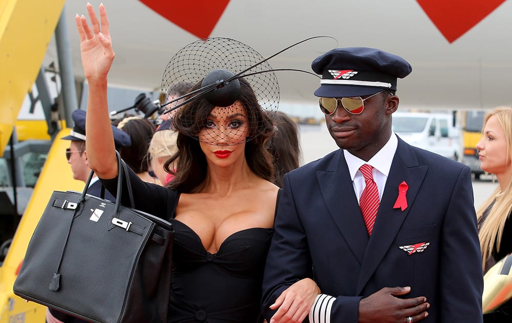 US model Yasmine Petty arrives for the largest annual AIDS charity gala in Europe known as the Life Ball, at the Vienna International Airport near Schwechat, Austria.