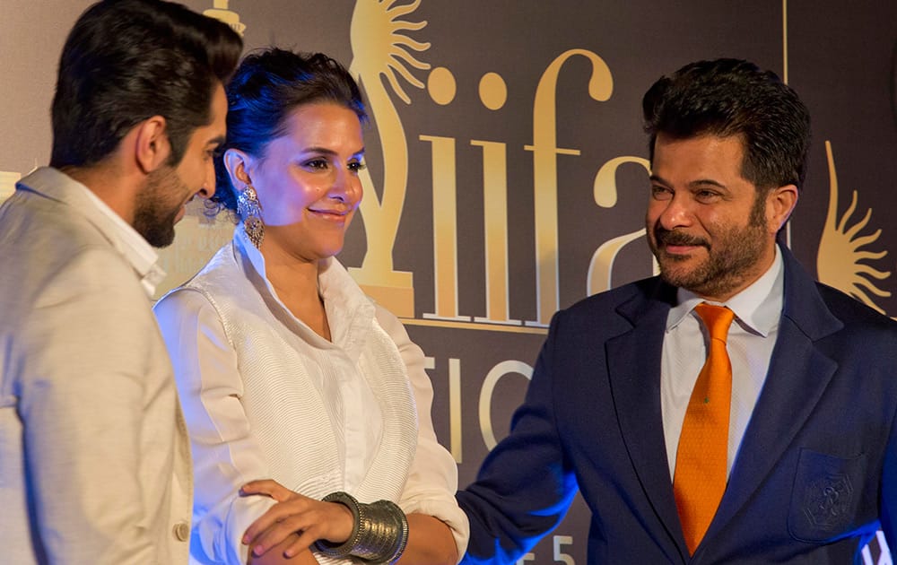 Ayushmann Khurrana, Neha Dhupia and Anil Kapoor attend a press conference held to announce the International Indian Film Academy award ceremony to be held in Kuala Lumpur in June, in New Delhi.