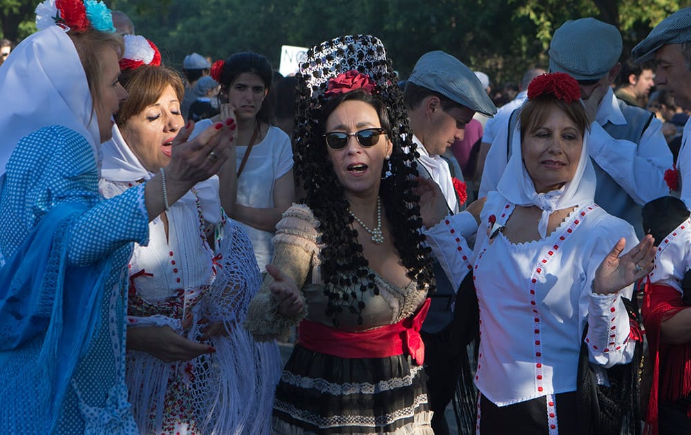 Women dressed as traditional 'Chulapas' take part in the San Isidro fiestas celebrating Madrid's patron saint, in Madrid, Spain.