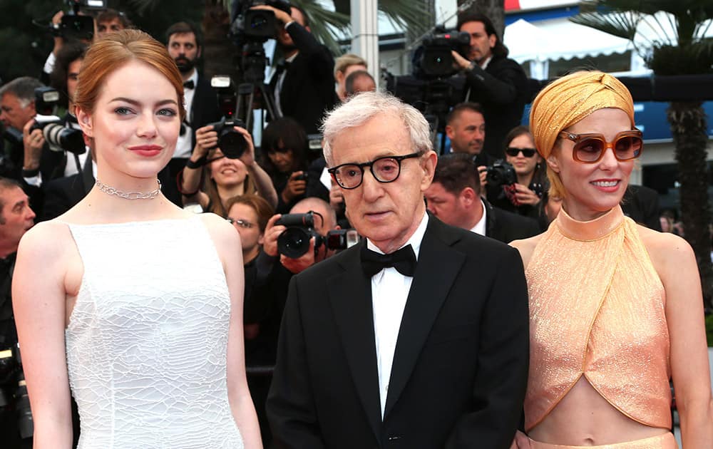 Actress Emma Stone, director Woody Allen and Parker Posey pose for photographers on the red carpet at the screening of the film Irrational Man at the 68th international film festival, Cannes, southern France.