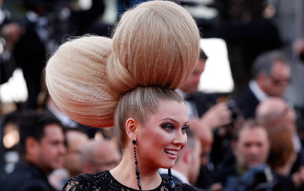 Television personality Elena Lenina pose for photographers as she arrives for the screening of the film Irrational Man at the 68th international film festival, Cannes, southern France.