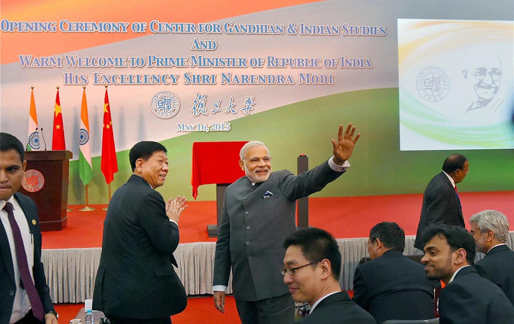 Prime Minister Narendra Modi waves during opening ceremony of Centre for Gandhian & Indian Studies at Fudan University in Shanghai.