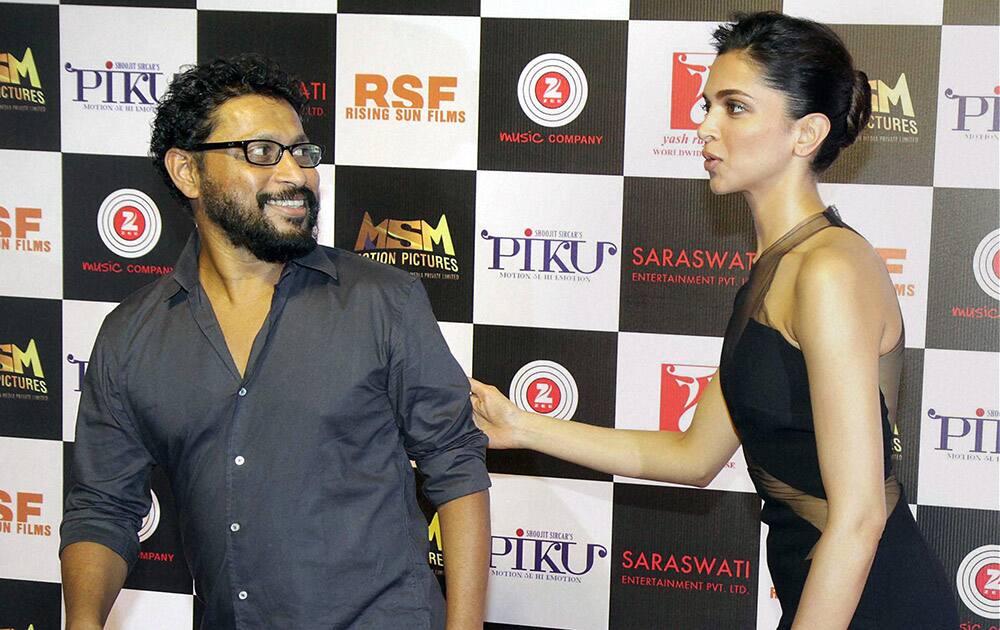 Deepika Padukone and director Shoojit Sircar attend a party for film Piku in Mumbai.