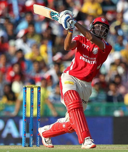 Akshar Patel of the Kings X1 Punjab hits over the top for a six during the IPL match against Chennai Super Kings in Mohali.