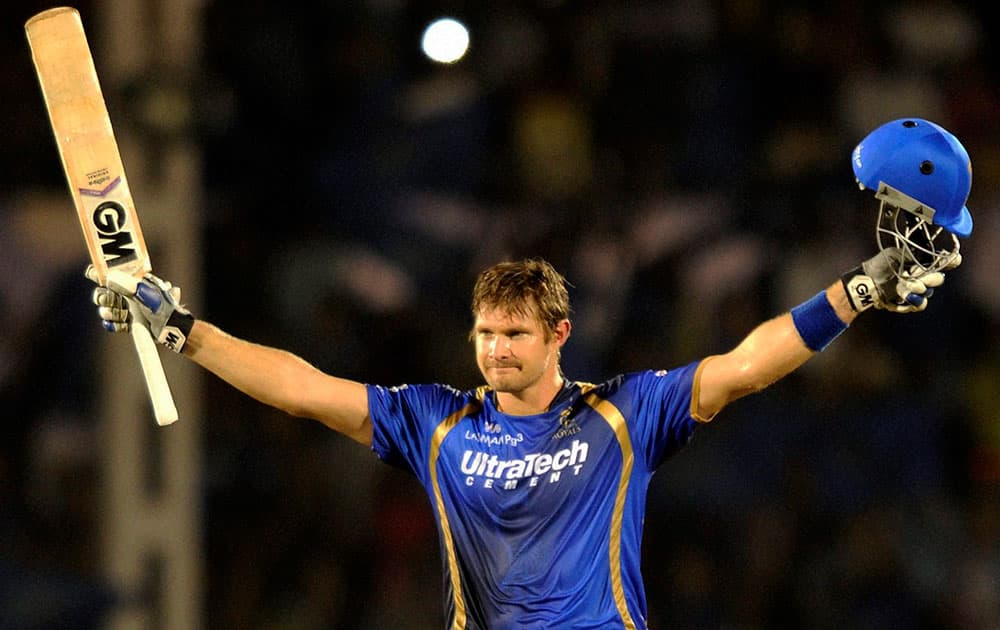 Rajasthan Royals batsman Shane Watson celebrates his century during the IPL match against Kolkata Knight Riders in Mumbai.