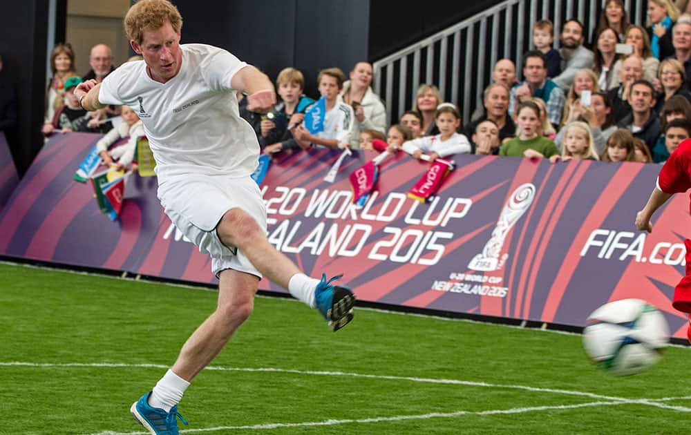 Britain's Prince Harry kicks the ball during a 5-a-side football game at The Cloud, a multi-purpose venue in Auckland, New Zealand.