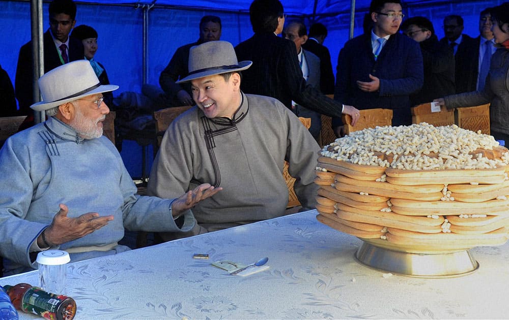 Prime Minister Narendra Modi with his Mongolian counterpart Chimediin Saikhanbileg during the Mini Naadam festival in Ulan Bator.