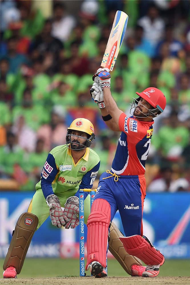 Delhi Daredevils J P Duminy plays a shot during IPL8 match against Royal Challengers Bangalore in Bengaluru.