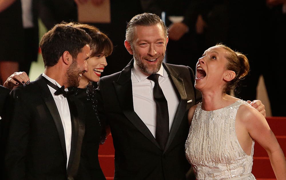 From left, actor Abdel Addala, director Maiwenn, actors Vincent Cassel and Emmanuelle Bercot pose for photographers as they arrive for the screening of the film Mon Roi (My King) at the 68th international film festival, Cannes.