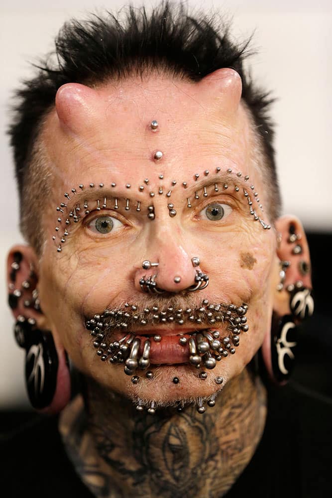 Rolf Buchholz, 56, poses for a photograph during the annual Athens Tattoo Convention in Athens.