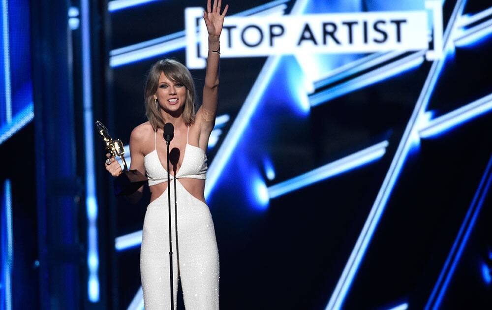 Taylor Swift accepts the award for top artist at the Billboard Music Awards at the MGM Grand Garden Arena in Las Vegas. 