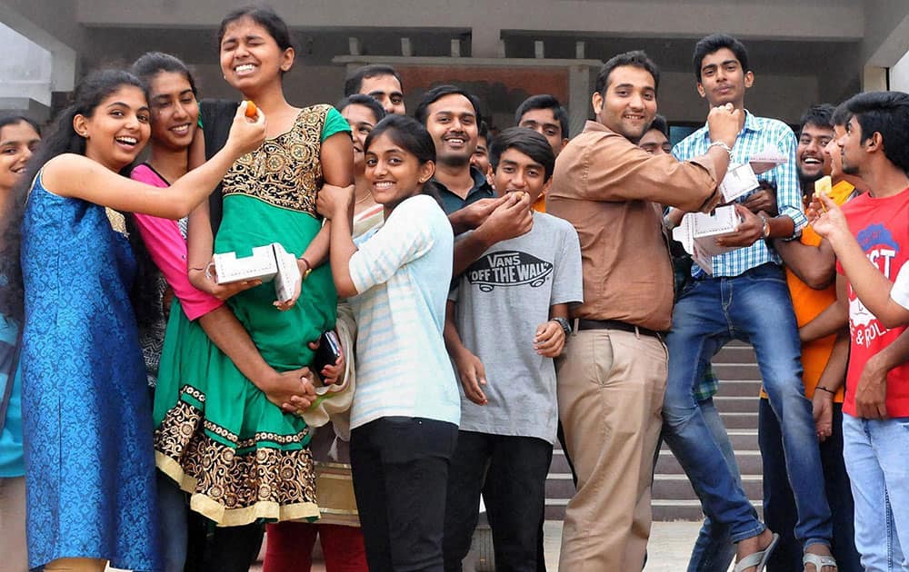Students celebrate after the announcements of the results for the Class 12th Second PUC (Pre-University Courses) Exams in Chikmagalur, Karnataka.