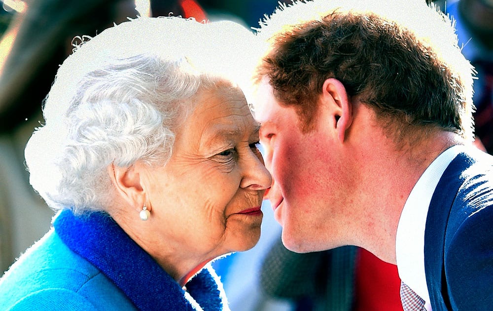 Britain's Queen Elizabeth greets her grandson Prince Harry at the Royal Horticultural Society Chelsea Flower Show 2015 in London.
