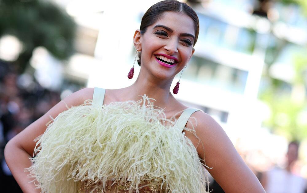 Actress Sonam Kapoor poses for photographers as she arrives for the screening of the film Inside Out at the 68th international film festival, Cannes.