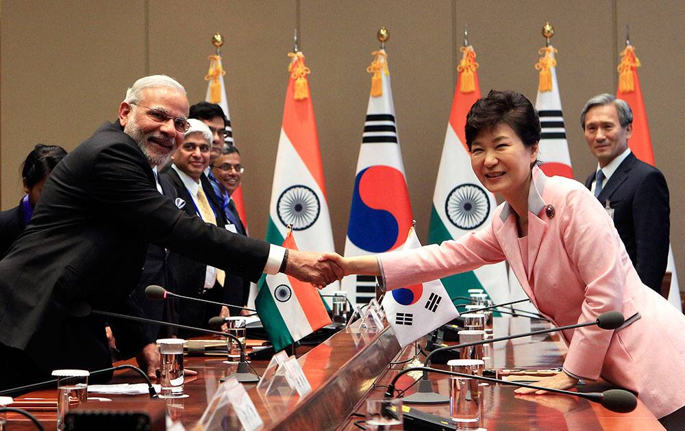 Prime Minister Narendra Modi shakes hands with South Korean President Park Geun-hye during a meeting at the presidential Blue House in Seoul, South Korea. 