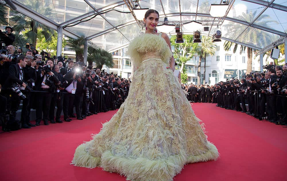 Actress Sonam Kapoor poses for photographers as she arrives for the screening of the film Inside Out at the 68th international film festival, Cannes.-Twitter