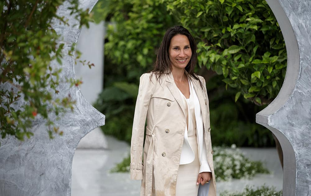 Designer Kamelia Bin Zaal poses for a picture in her garden called The Beauty of Islam by Al Barari at the Chelsea Flower Show in London.