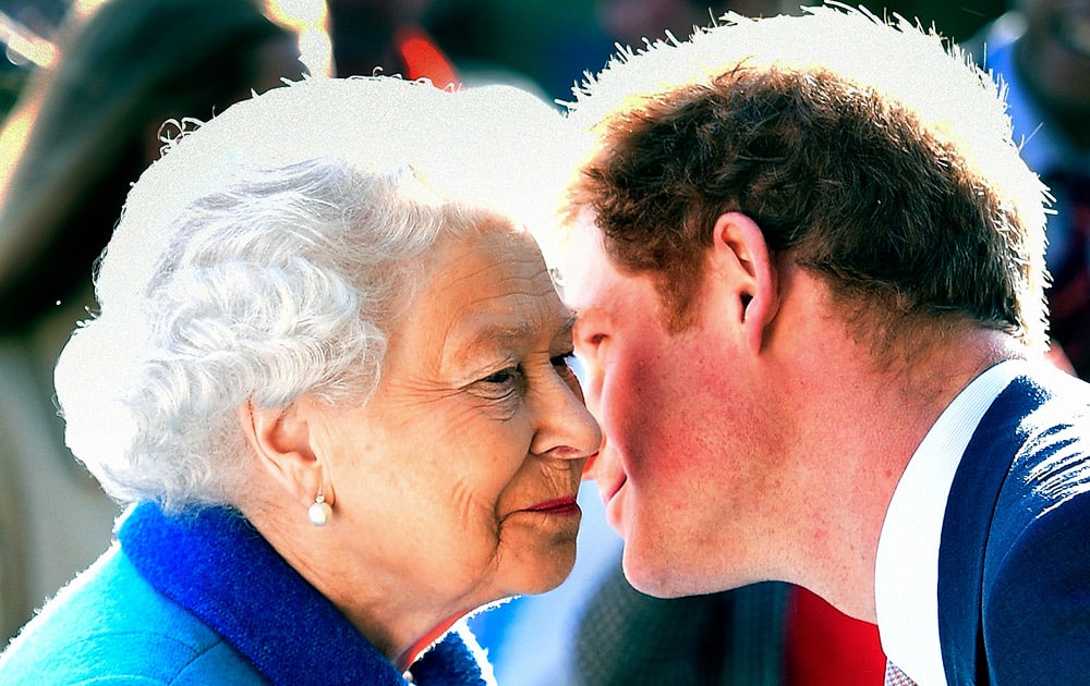 Britain's Queen Elizabeth greets her grandson Prince Harry at the Royal Horticultural Society Chelsea Flower Show 2015 in London.