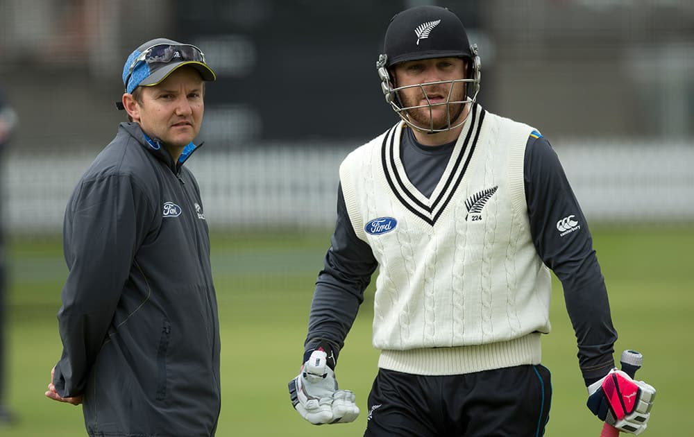 New Zealand crickets head coach Mike Hesson and his captain Brendon McCullum talk during a nets session at Lord's cricket ground in London. England an New Zealand will play a two test series starting with the first test at Lord's on May 20. 