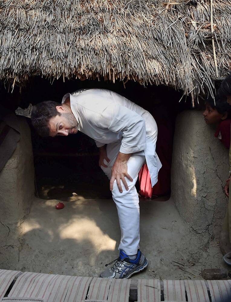 Congress Vice President Rahul Gandhi comes out of a house in a village during his visit to Amethi.