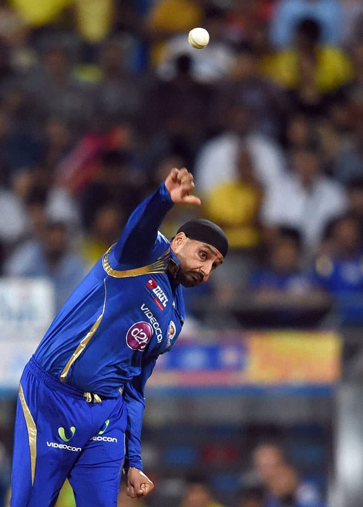 Mumbai Indians player Harbhajan Singh bowls during the first qualifier match of IPL in Mumbai.