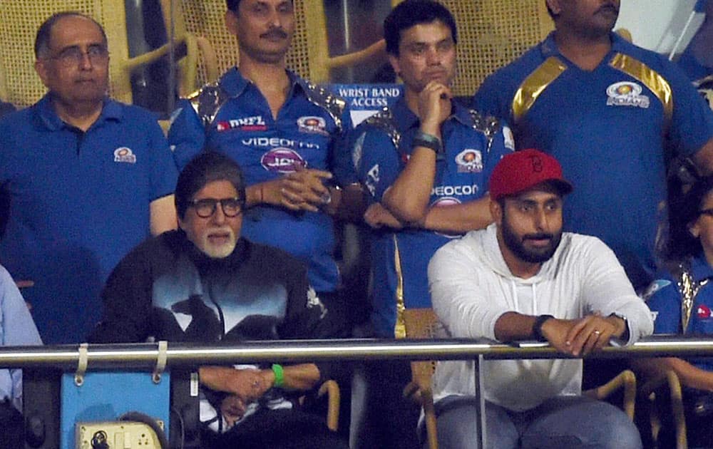 Bollywood Star Amitabh Bachchan alongwith son Abhishek Bachchan during the IPL 8 first qualifier match between Mumbai Indians and Chennai Super Kings in Mumbai.
