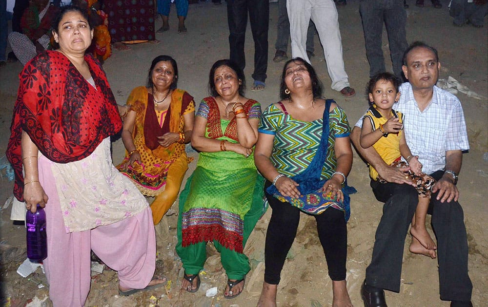 Family members mourn after a motor boat sinked at Sangam in Allahabad.