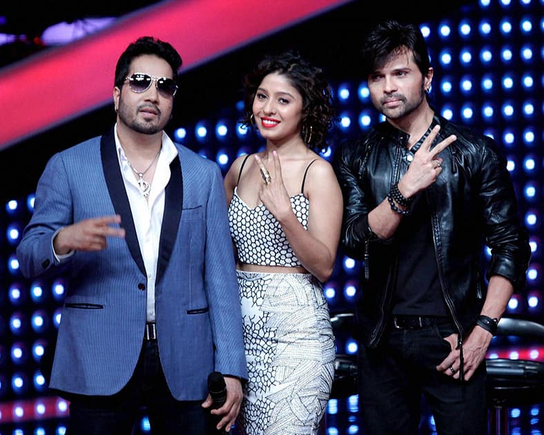 Bollywood singers Mika Singh, Sunidhi Chauhan and Music Director and singer Himesh Reshamiya during a show.