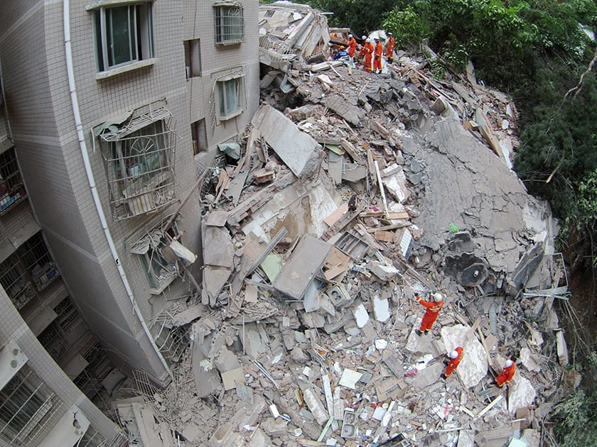 Rescuers work amid the debris of a collapsed nine-story residential building in Guiyang in southwestern China's Guizhou province.