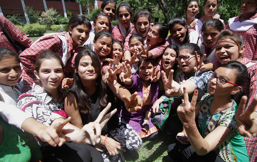 School-girls celebrate after declaration of Jammu and Kashmir State Board Class 12 results in Jammu.