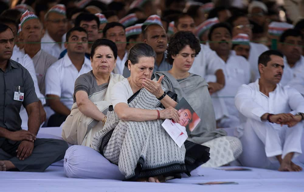 Congress party President Sonia Gandhi listens to devotional songs after paying homage to her husband and former Indian prime minister Rajiv Gandhi on his death anniversary in New Delhi.