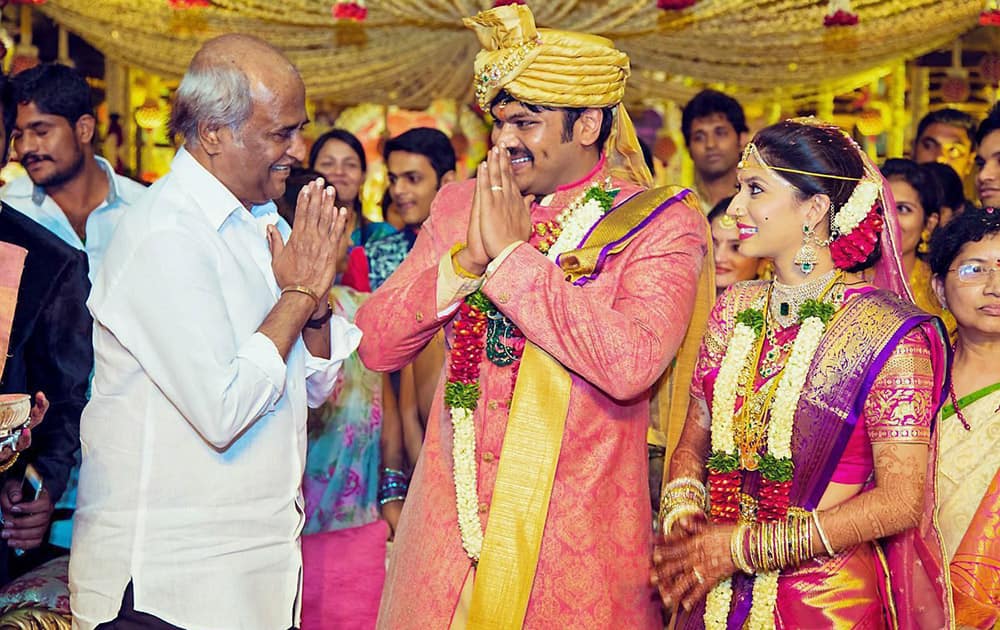 Rajinikanth greets actor Mohan Babus son Manchu Manoj during his wedding ceremony in Hyderabad.