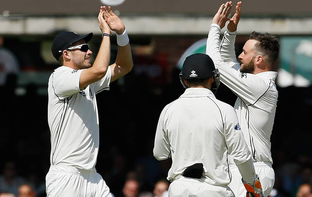 New Zealand's Mark Craig celebrates the wicket of England's Ben Stokes, bowled for 92, during the first day of the first Test match at Lord's cricket ground in London.