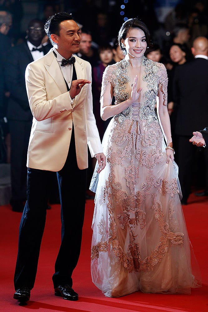 Actors Chang Chen and Shu Qi pose for photographers as they arrive for the screening of the film Nie Yinniang (The Assassin) at the 68th international film festival, Cannes, southern France.