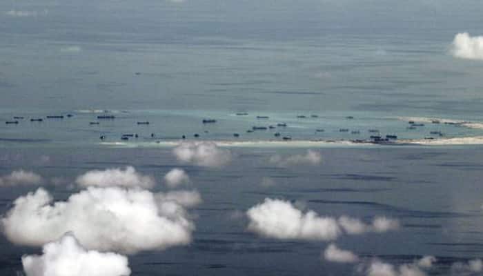 China Navy warns US spy plane eight times to leave disputed South China Sea