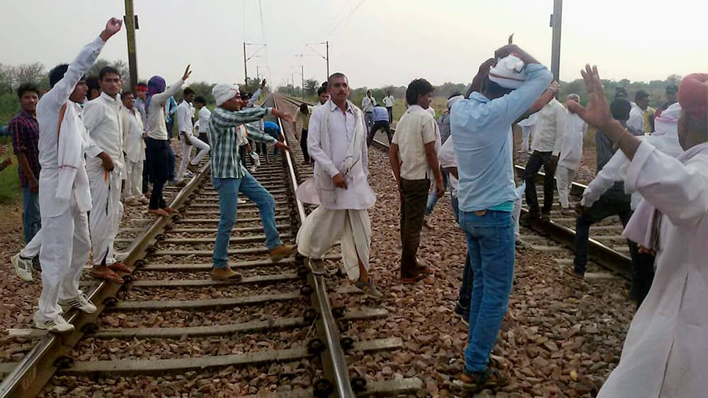 Gujjar community people agitating to demand reservation in government jobs and educational institutions for their community on Delhi-Mumbai railway track near Bayana village.