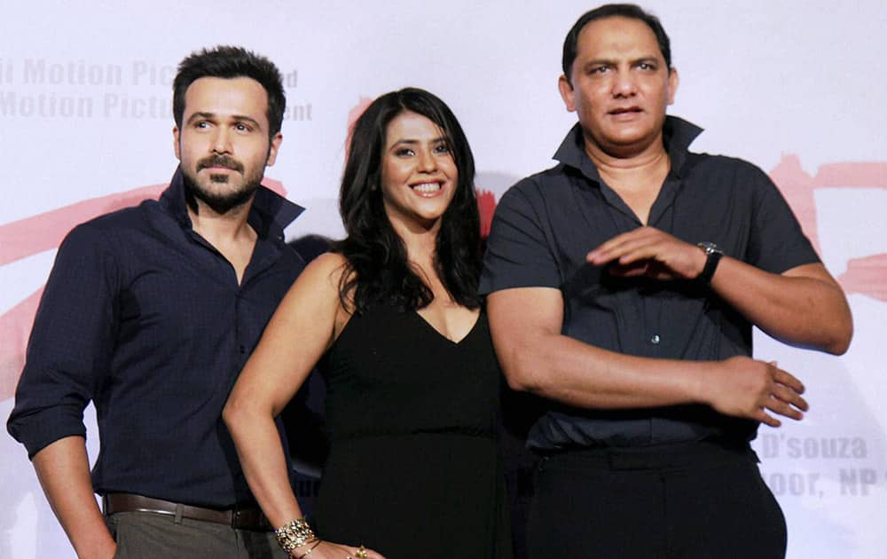 Mohammad Azharuddin with Ekta Kapoor and Emraan Hashmi pose at the preview of film Azhar, in Mumbai.