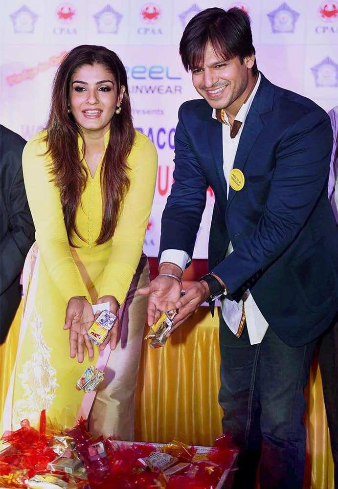 Raveena Tandon and Vivek Oberoi at the launch of Tobacco free Mumbai Police Station initiative in Mumbai.