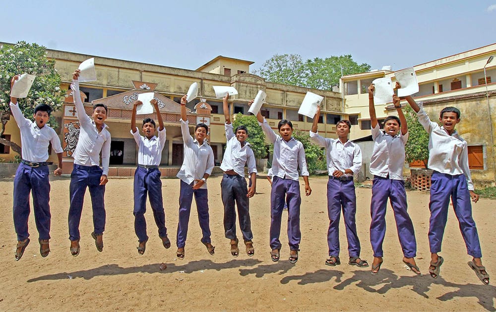 Students celebrate their success in the West Bengal Board Class 10th Examination after their results were declared at Bolpur in Birbhum district of West Bengal.