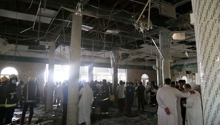 Suicide bomber kills at least 21 at Saudi Shi&#039;ite mosque, Islamic State claims attack