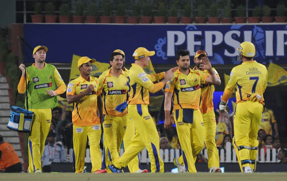 Chennai Super Kings players celebrate a wicket Royal Challngers Bangalores batsman Chris Gayle during the 2nd qualifier match of IPL 8 at Ranchi.