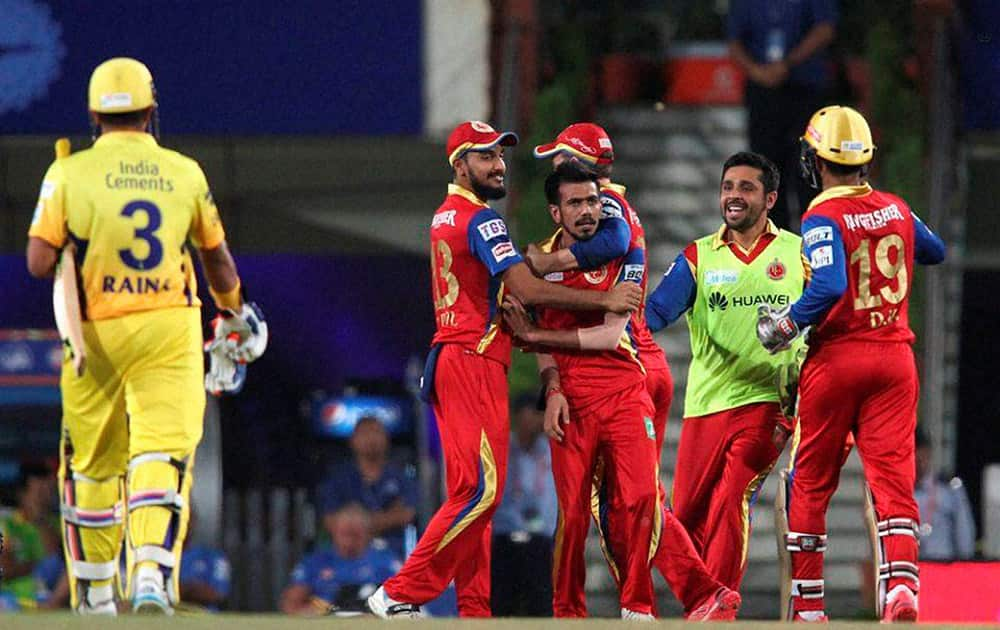 Royal Challengers Bangalore players celebrates the wicket of Suresh Raina of the Chennai Superkings during the 2nd qualifier match of the IPL 8, in Ranchi.