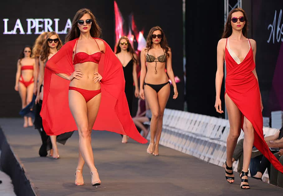 Models display creations part of the Italian fashion label La Perla's Spring-Summer 2015 beachwear collection, during the summer fashion week at Saint George Yacht Club, in Beirut, Lebanon.