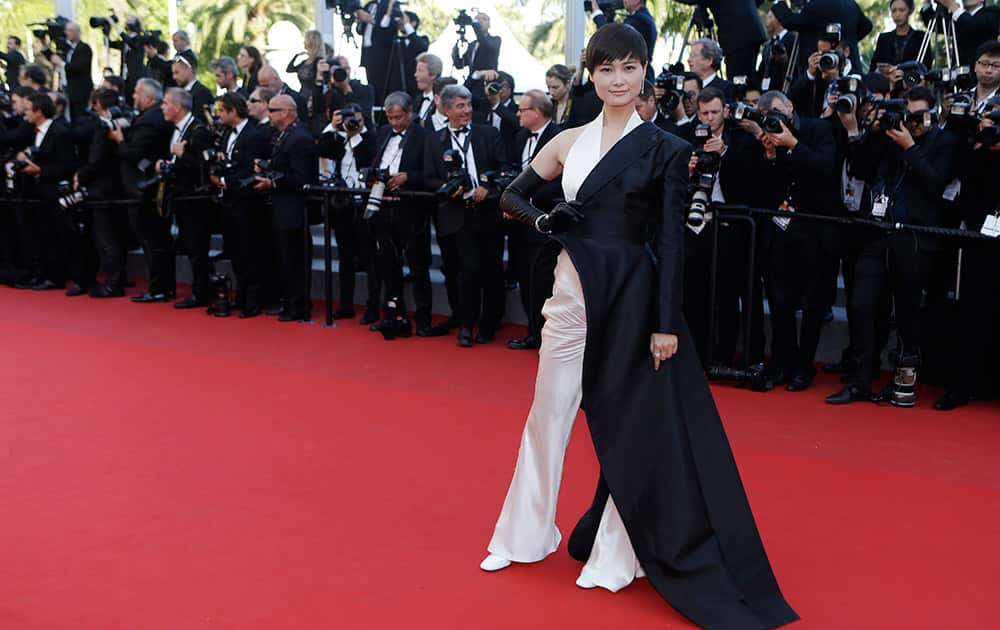 Singer Li Yuchun poses for photographers upon arrival for the screening of the film The Little Prince at the 68th international film festival, Cannes.