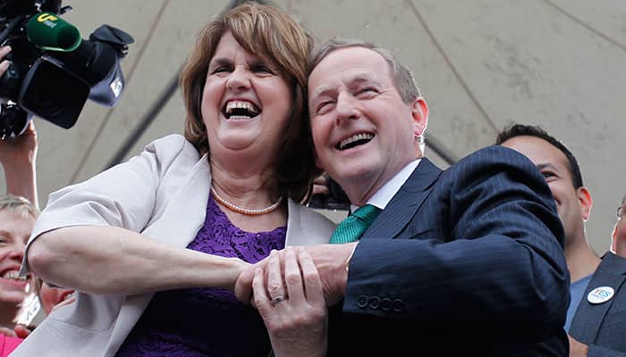 Irish Prime Minister Enda Kenny, right, and Deputy Prime Minister Joan Burton celebrate at Dublin castle, Ireland.