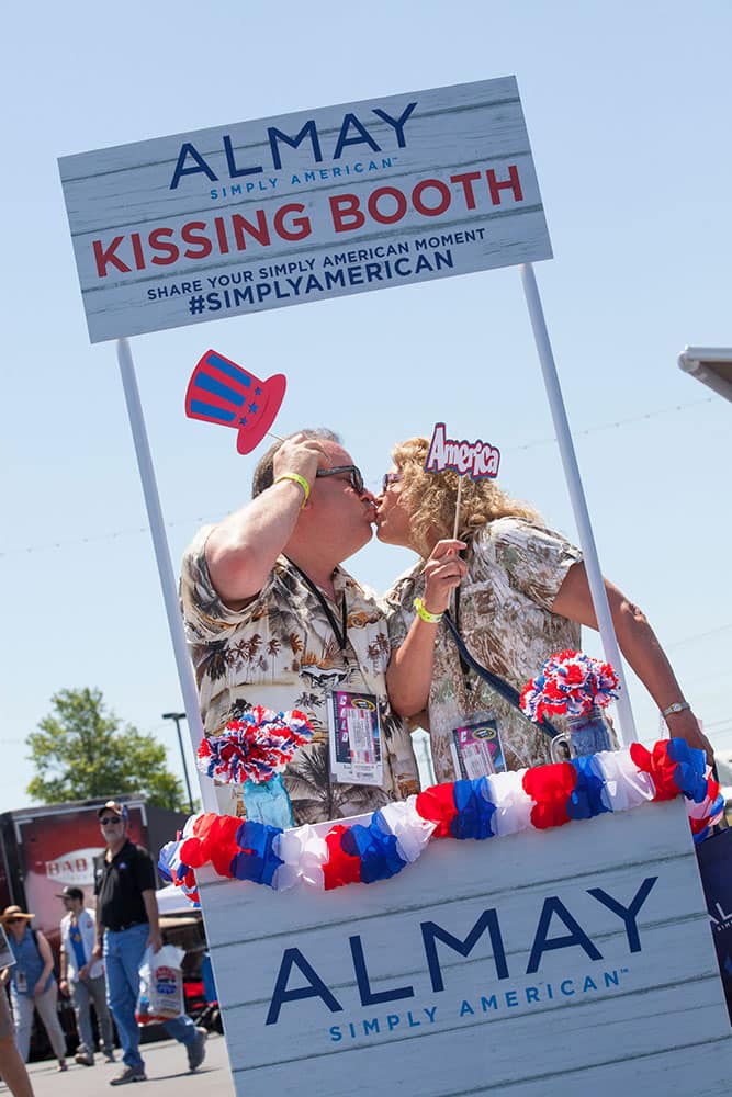 Guests show their American spirit at the Almay kissing booth during the Almay's Simply American Experience in Concord, N.C.