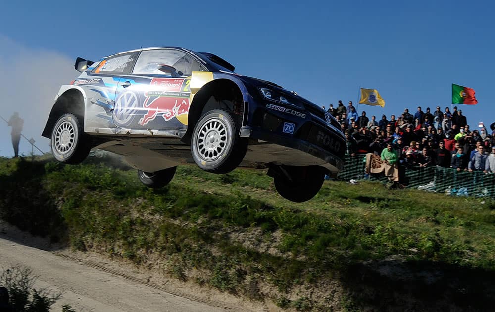 Volkswagen Motorsport driver Jari-Matti Latvala and his co-driver Miikka Anttila, both from Finland, steer their Volkswagen Polo R WRC during the Portugal FIA World Rally Championship in Lameirinha, Fafe, Portugal.