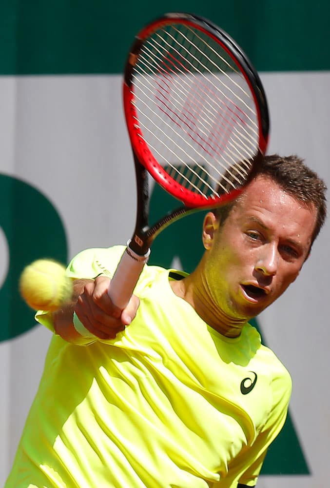 Germany's Philipp Kohlschreiber returns the ball to Japan's Go Soeda during their first round match of the French Open tennis tournament.